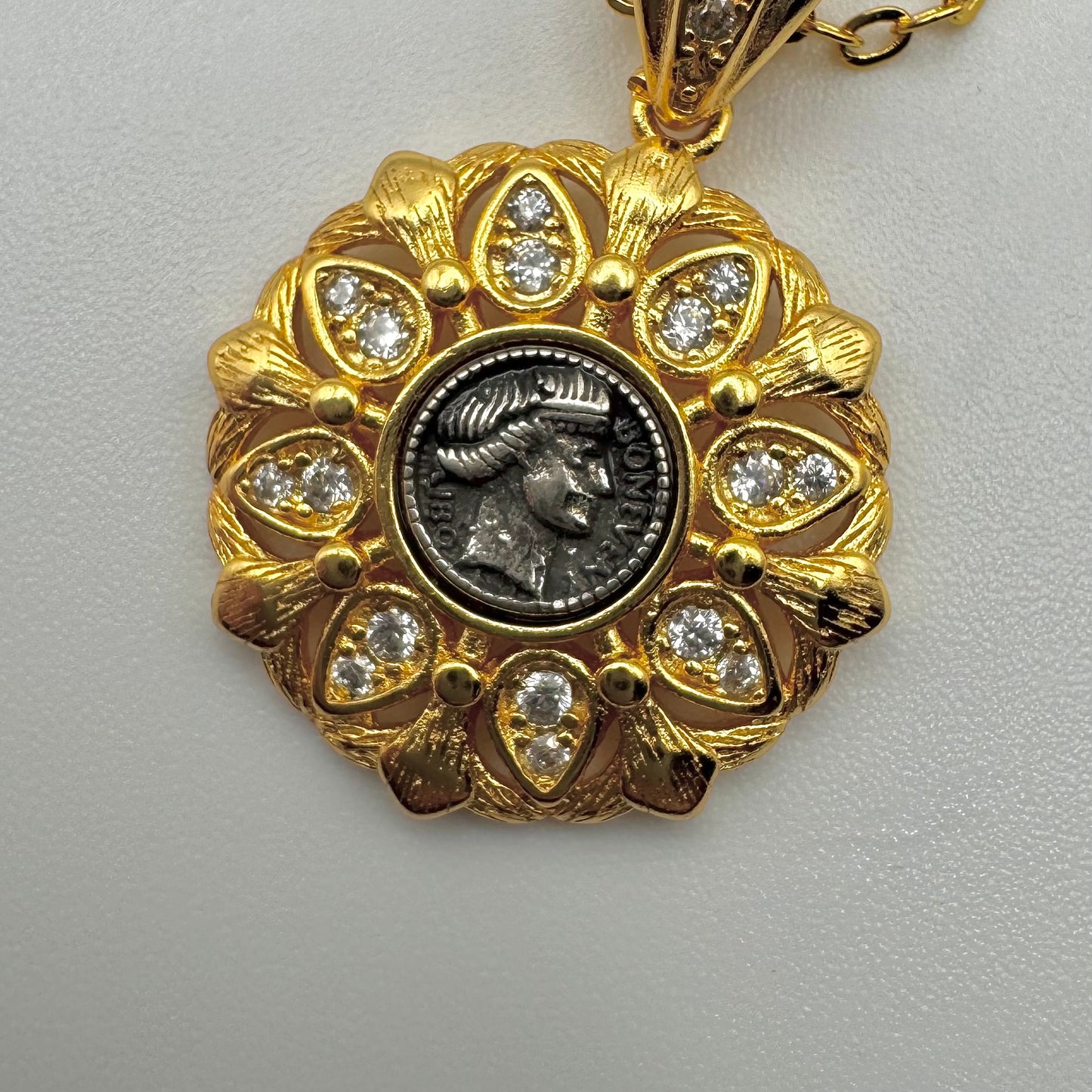 Gold pendant with central roman emperor/empress coin design. Vintage styled roman jewlery