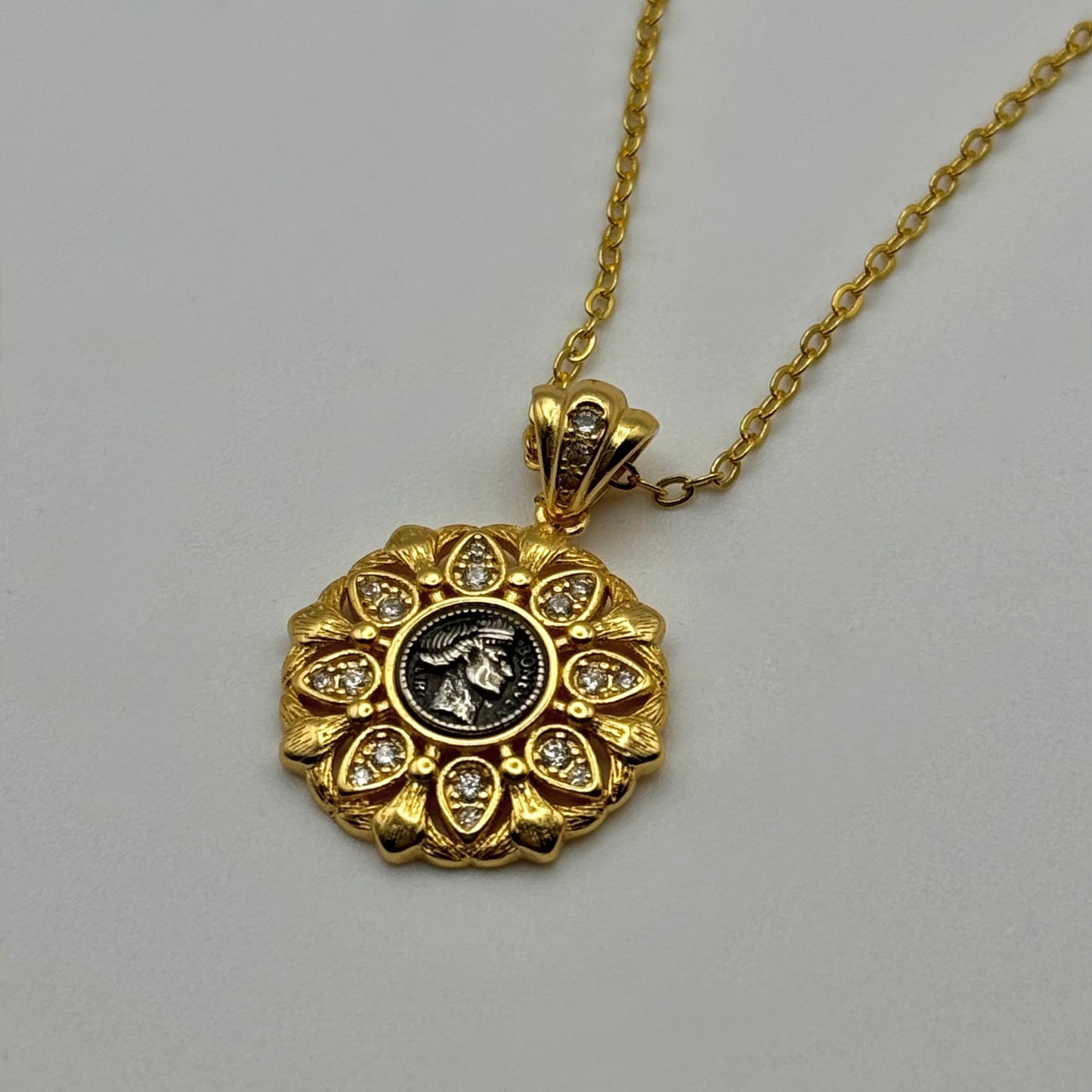 Gold pendant with central roman emperor/empress coin design. Vintage styled roman jewlery