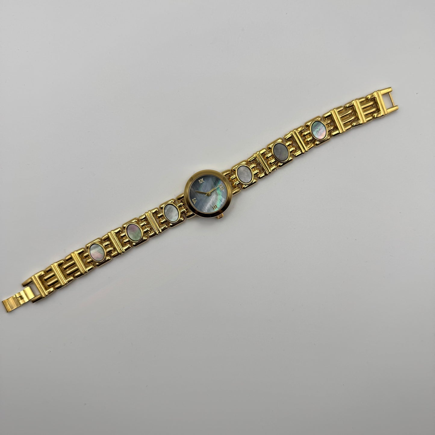 Gold bracelet watch with gemstone accents - Blue pearl dial - Vintage styled gold watch 