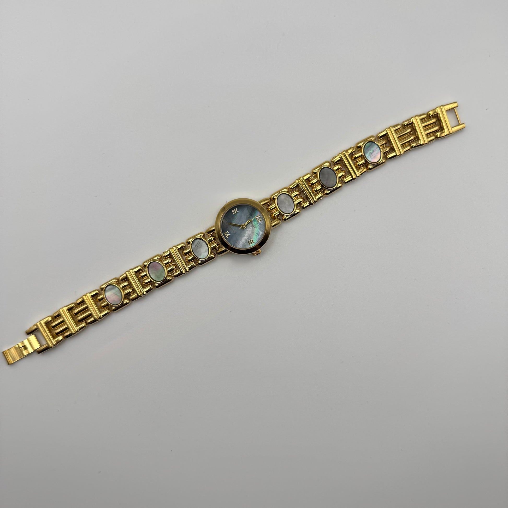 Gold bracelet watch with gemstone accents - Blue pearl dial - Vintage styled gold watch 